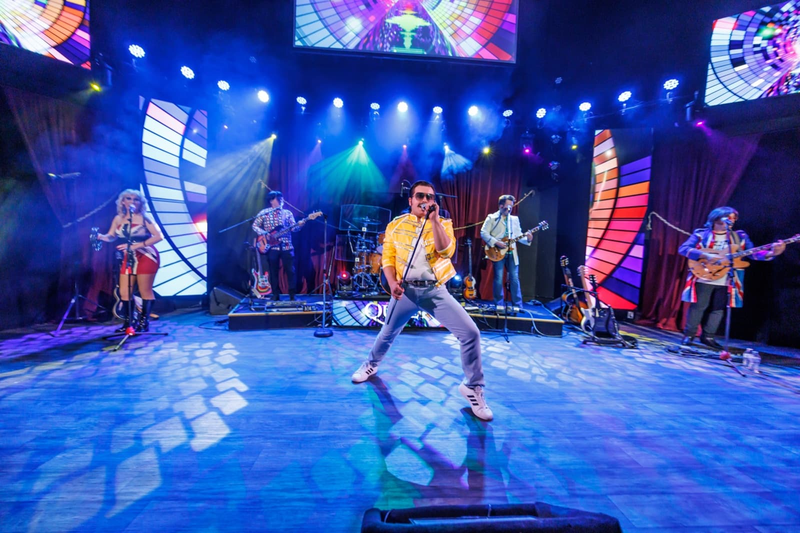 British Invasion cast performing on stage at The Showroom at Branson Meadows